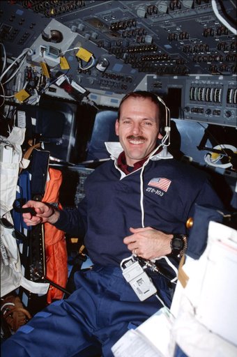 Various views of the STS-103 crew on the flight deck