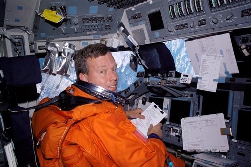 STS-104 CDR Lindsey on forward flight deck prior to re-entry