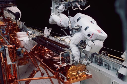 EVA 2 - old solar array installed in payload bay