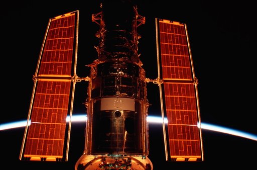 HST in Columbia's payload bay during sunrise
