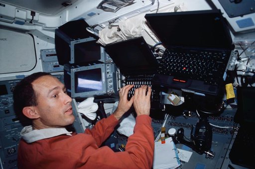 MS Newman enters data into a PGSC on flight deck