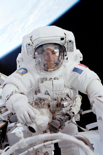 Perrin smiles through the visor of his EVA helmet while working beside the MBS during STS-111 EVA 2