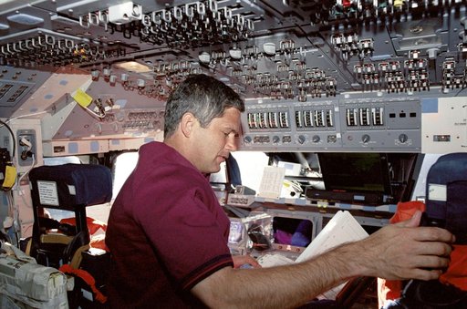 Lockhart reads a checklist on Endeavour's FD during STS-111 UF-2