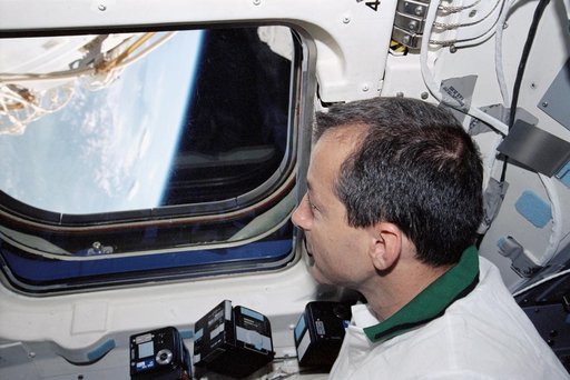 Perrin peers through Endeavour's AFD window to view the Earth's limb during STS-111