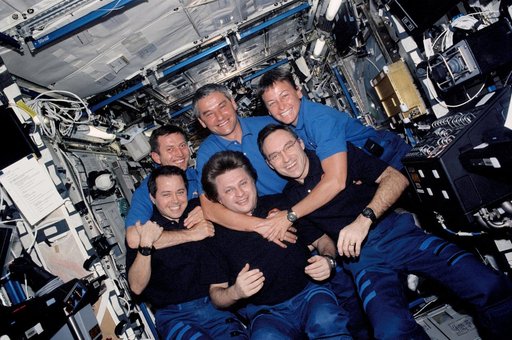 Expedition Four and Expedition Five crews group portrait in U.S. Lab taken during STS-111 UF-2