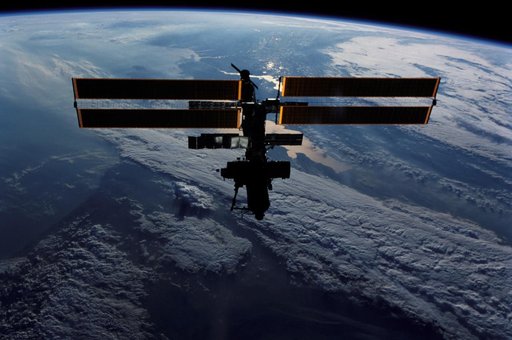 Zenith view of the ISS silhouetted against Earth's limb taken during STS-111 UF-2 Flyaround