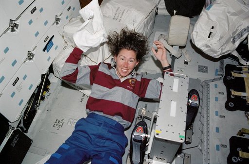 STS-112 MS Magnus washes hair on Atlantis middeck