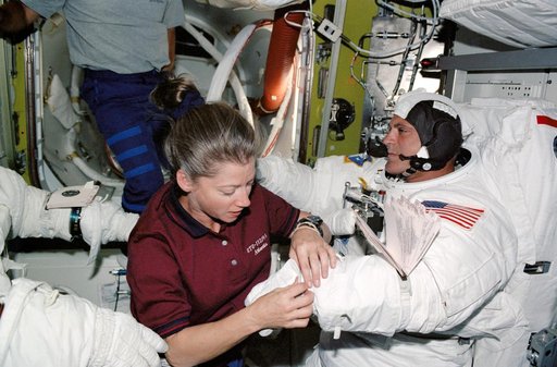 STS-112 PLT Melroy with MS Wolf  in Quest airlock prior to EVA 2