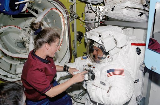 STS-112  PLT Melroy and MS Wolf in Quest airlock prior to EVA 2