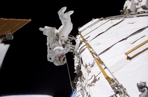 Herrington works at the P1 truss during  STS-113 EVA 3