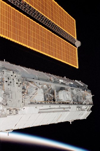 P1 truss backdropped against Earth's limb with SA visible during STS-113