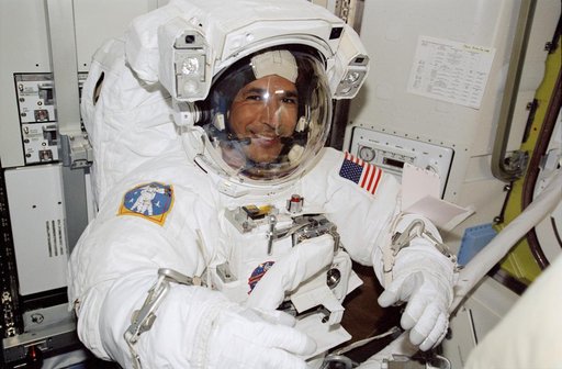 Herrington, in EMU, during preparations for STS-113 EVA 1 in the Quest A/L