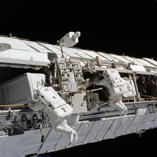 Lopez-Alegria and Herrington work near CETA cart 2 during STS-113 EVA OPS