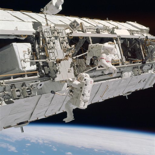 Lopez-Alegria and Herrington work near CETA cart 2 during STS-113 EVA OPS