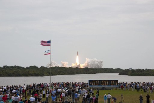 Spectators watch the Final Launch of STS-135 Atlantis