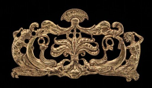 Ornamental appliqué with tritons, dolphins, and seed-pods