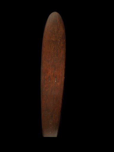 Surfboard shaped by Duke Kahanamoku on the beach at Corona Del Mar, California in 1928