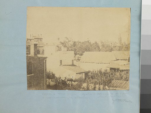 Rooftops, buildings, houses with chimneys and a steeple