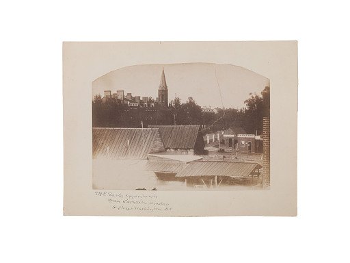 City view with steeple and store