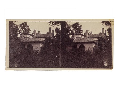 House with double arches among trees