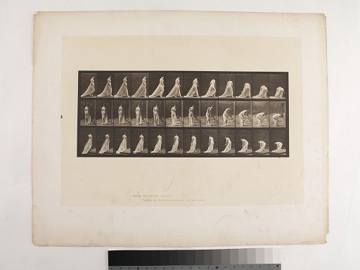 "Animal Locomotion. Plate 56."; Female, Walking turning and stooping to lift train
