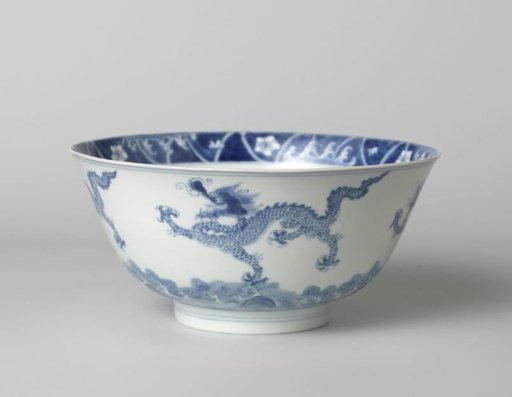 Bowl with dragons above waves
