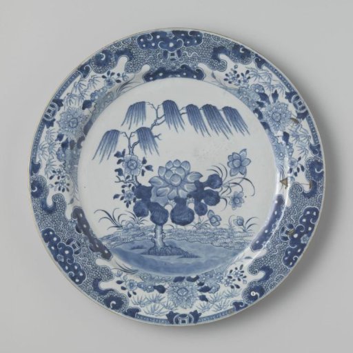 Dish with a pine tree and flowering plants