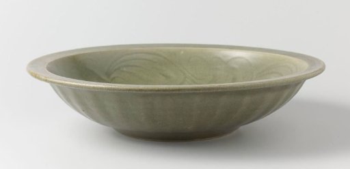 Dish with a dragon in relief and incised floral scrolls