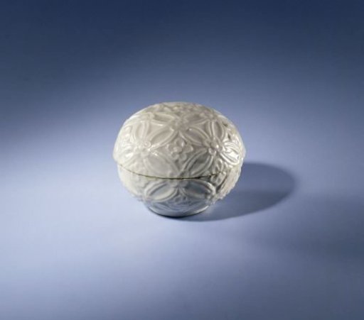 Round-bodied box with continuous flower motif in relief
