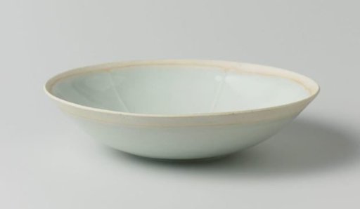 Bowl with incised fish among waves