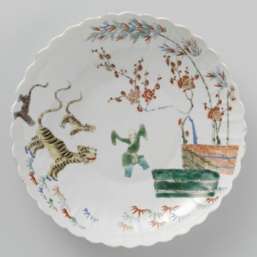 Saucer-dish with bamboo, prunus, tiger and a Chinese boy