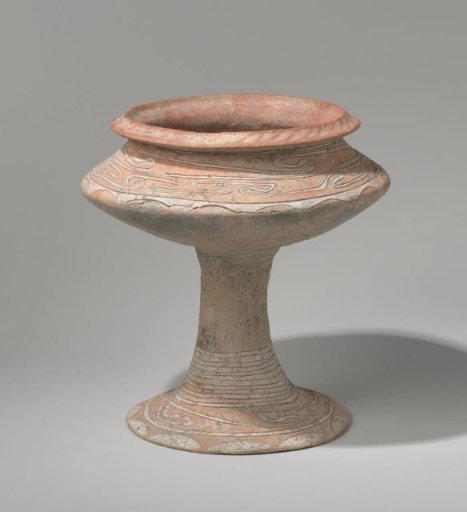 Beaker vase with an incised spiralled pattern