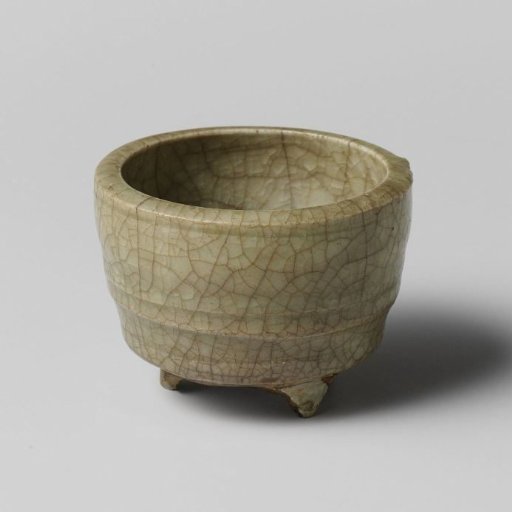 Incense burner with fluted sides and three legs