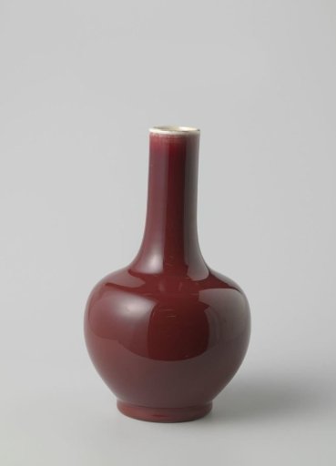 Squat ovoid bottle vase with a red glaze