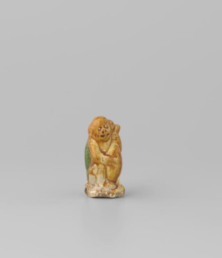 Monkey holding a wine bag