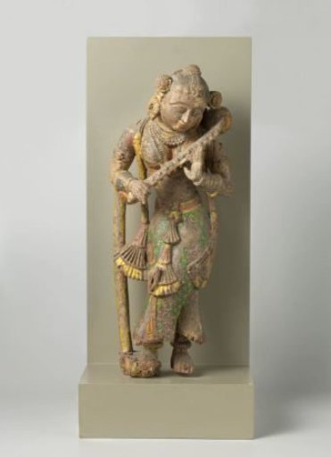 Image of a woman playing the vina