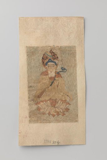 Buddha with a ruyi in his hand, seated on a lotus
