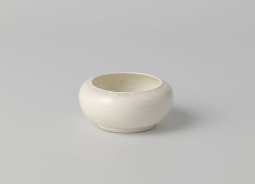 Bowl with rounded sides and a band of scroll work