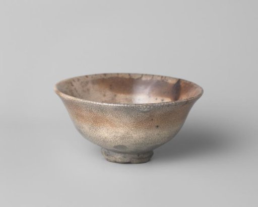 Bowl with a greyish brown spotted cream glaze
