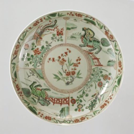 Saucer-dish with celadon glaze, prunus sprays, shishi, peacock and feng huangs