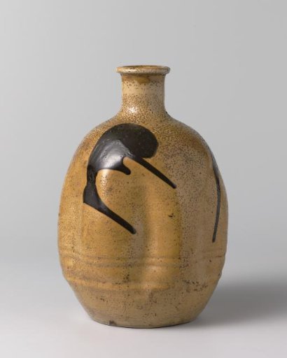 Ovoid sake bottle with a yellow glaze and brown marks