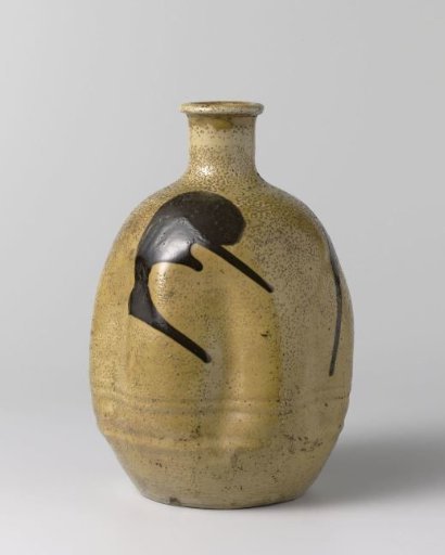 Ovoid sake bottle with a yellow glaze and brown marks