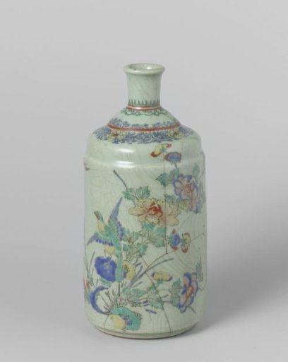 Sake bottle with a bird on a rock with flowering plants
