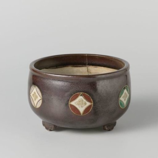Incense burner with a 'tea dust' glaze and roundels with flowers