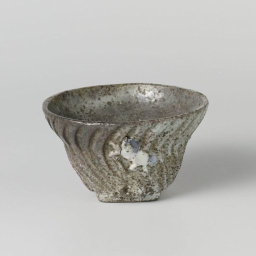 Tea bowl with incised waves and a moulded horse