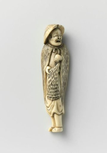 Netsuke in the form of a fisherman in rain gear