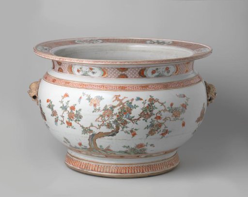 Fish bowl with flowering plants, animals and moulded lion-heads