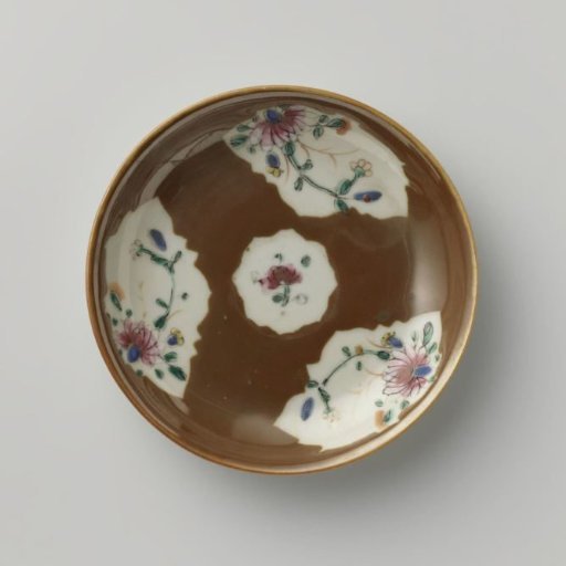 Saucer with flower sprays in panels on a brown glaze