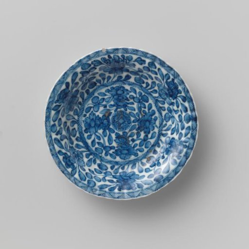 Saucer with fluted sides, covered all over with flower sprays