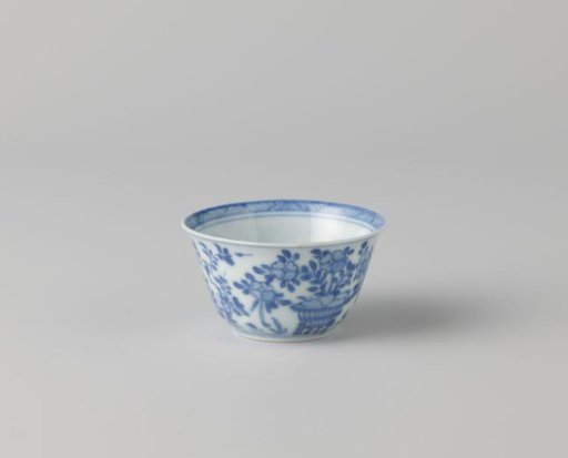 Cup with a bird of prey, flower basket and plants